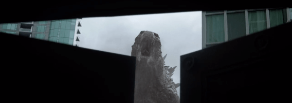 Godzilla's face is revealed in the brief seconds the door closes. 