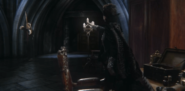 Robin draws his bow on Regina while she suffocates him. Not your average first date, but it'll do.